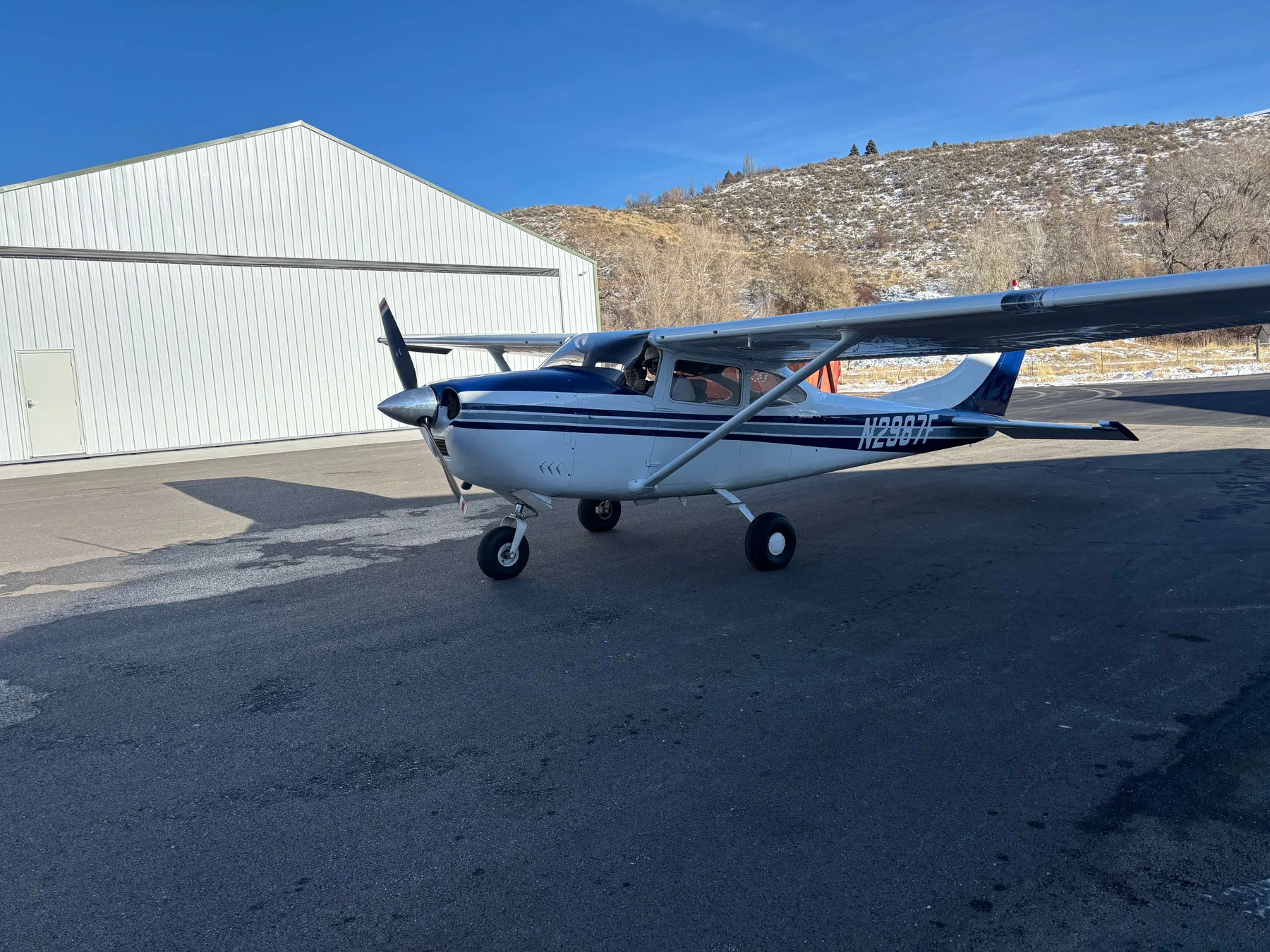 N2987F viewed from the front right outside its hangar